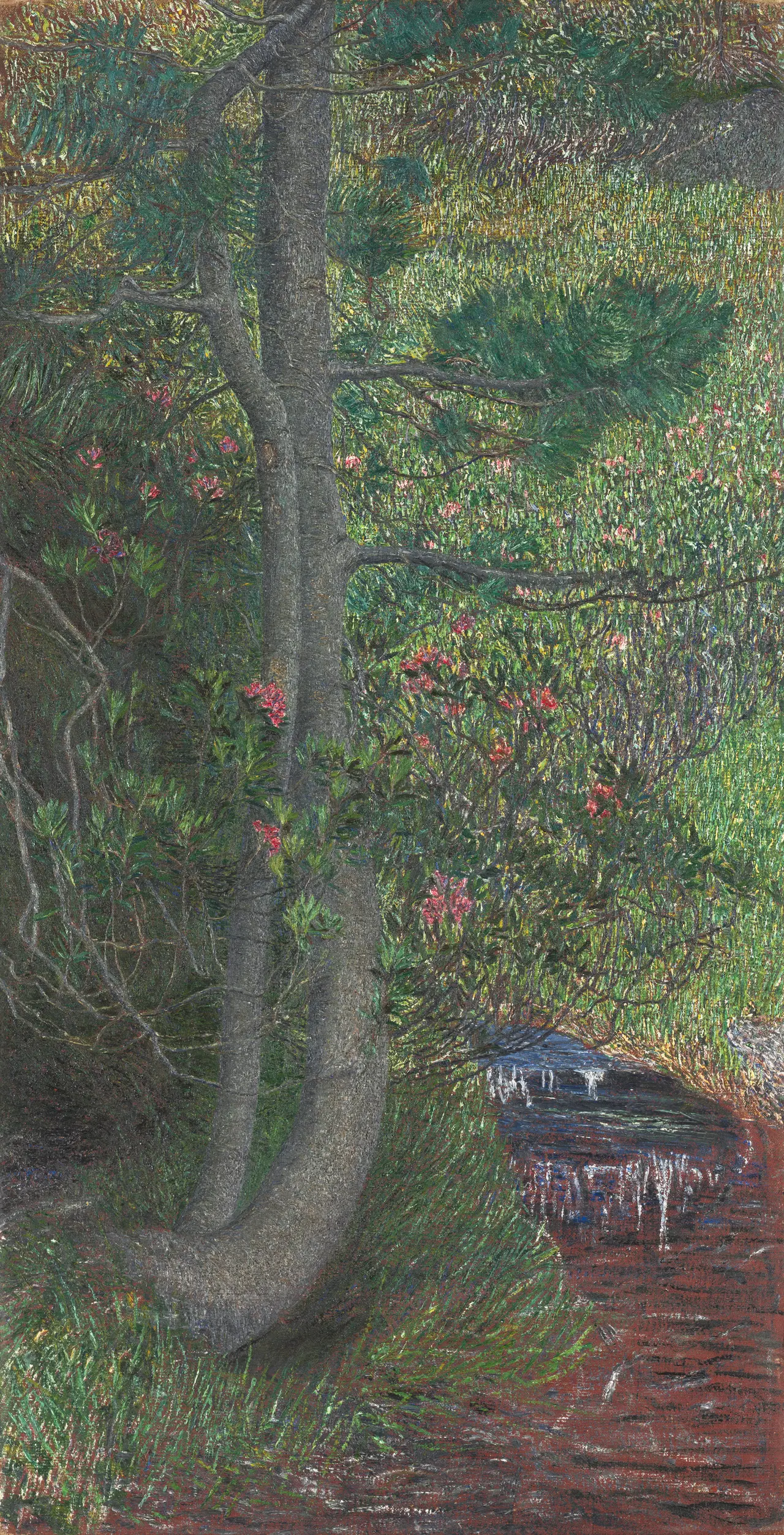 Vertical oil painting of a pine tree with dense broken strokes in green and yellow, a grey trunk at left, pink flower clusters, and a small stream at lower right with exposed reddish ground.