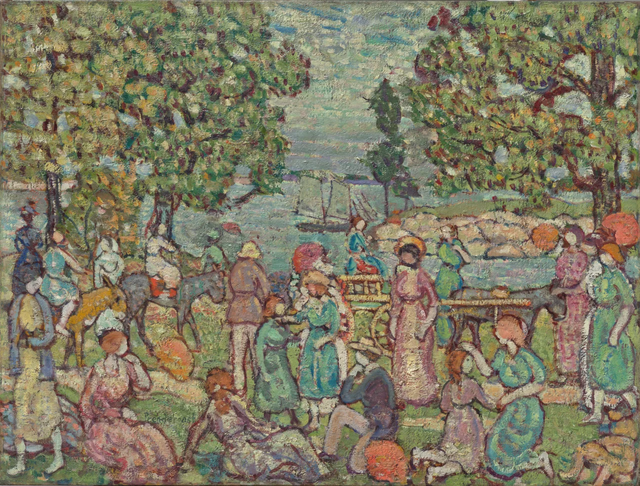 A dense seaside crowd sits and walks near a horse and donkey cart beneath trees, with boats on blue water behind.