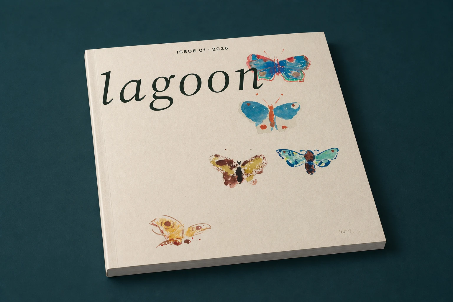 Closed Lagoon Issue 01 lying on a deep blue-green surface, with its spine and page edges visible