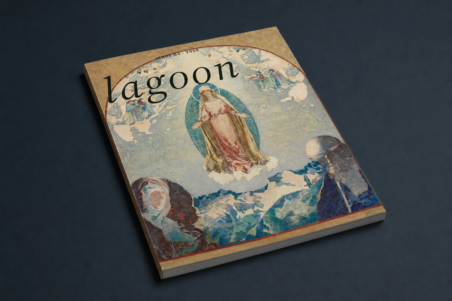 Lagoon Issue 03 lying cover-forward on a charcoal-blue surface, with its spine and page block visible